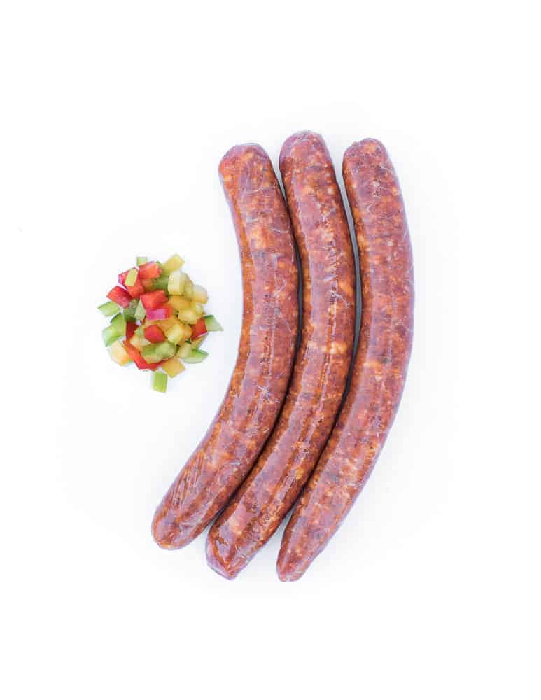 La piquante, saucisse au piment d'Espelette. Maison Alpin. Vente en direct de la salaison familiale. Charcuterie artisanale, saucisson, saucisse, diot, jambon, de Haute-Savoie & viande de qualité supérieure en ligne.